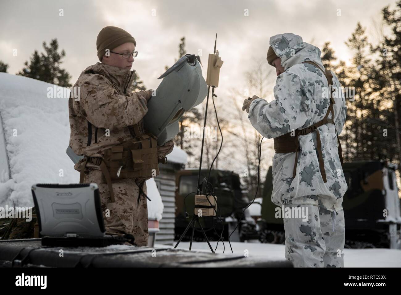 U.S. Marines with Marine Rotational Force-Europe 19.1, Marine Forces Europe and Africa, assemble an RQ-20B Puma unmanned aerial vehicle during Exercise Snow Panzer in Setermoen, Norway, Feb. 11, 2019. Snow Panzer is a force-on-force bilateral exercise between MRF-E and the Panzer Battalion of Brigade Nord. Stock Photo