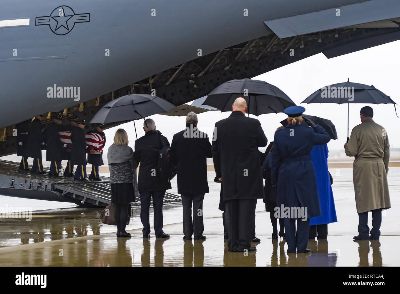 The U.S. Army 3rd Infantry Regiment (The Old Guard) body bearer team carries the casket of World War II Army veteran and former Rep. John D. Dingell (D-Mich.) at an Arrival Ceremony at Joint Base Andrews, Md., Feb. 12, 2019. The longest-serving Congressional member in American history from 1955 to 2015, Dingell passed away Feb.7, 2019, in Dearborn, Mich. The U.S. Armed Forces will provide military ceremonial support throughout the funeral and interment of Dingell in Michigan and Washington, D.C. Stock Photo