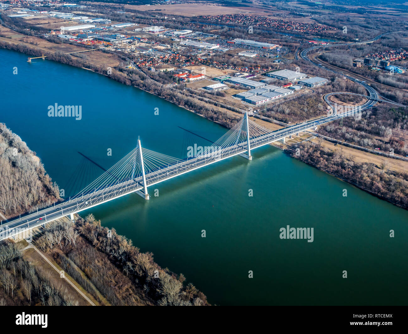 Image of areal view over the Hungarian capital city of Budapest with the river of danube and historical buildings and bridges during sunset Stock Photo