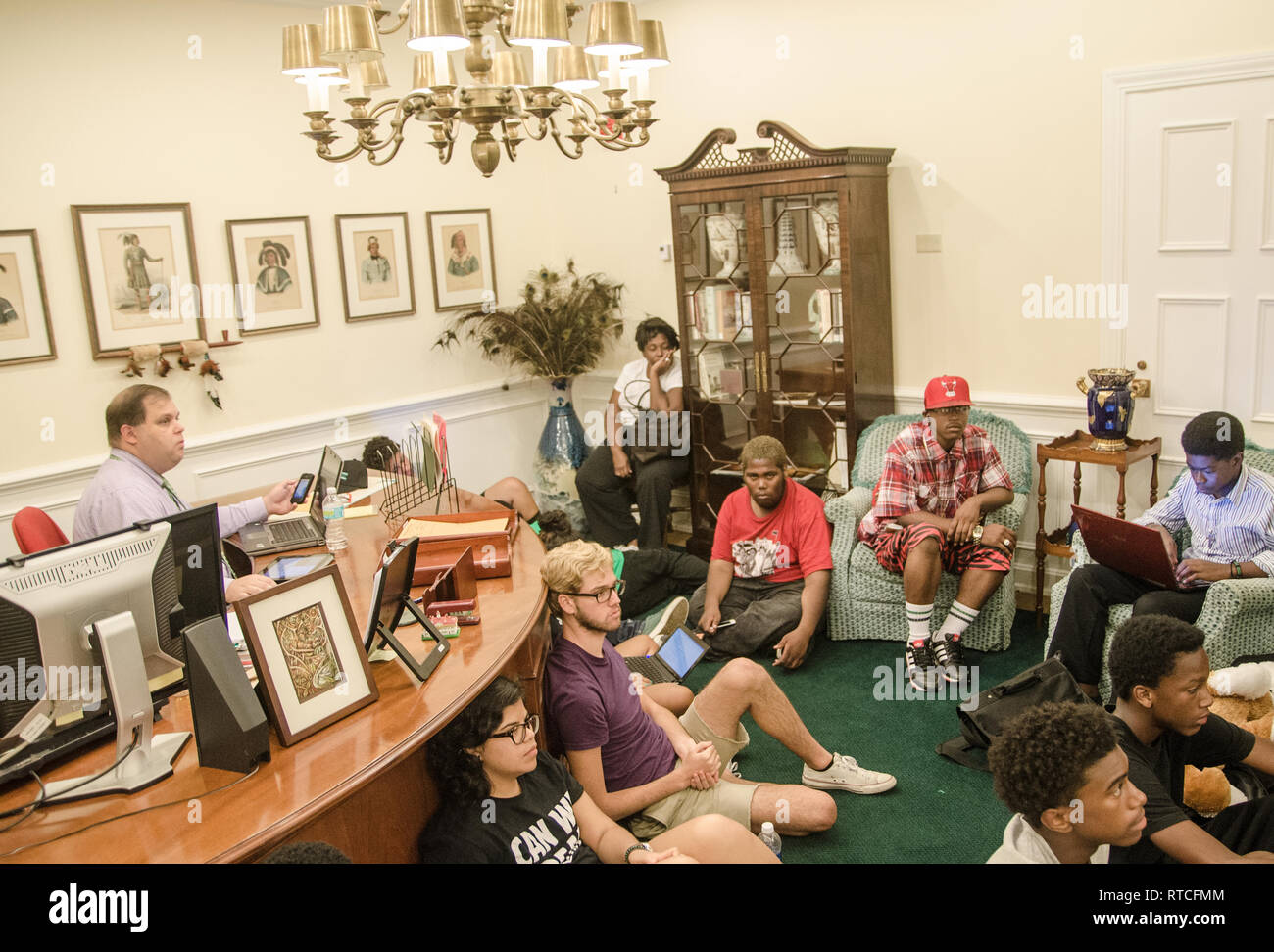 Pat Fargason (left), communications specialist for the Florida Department of Juvenile Justice, watches a Dream Defenders meeting in Tallahassee. Stock Photo