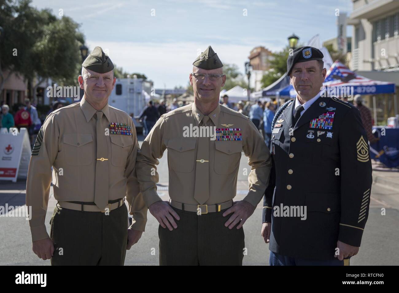 U.S. Marine Corps Col. David A. Suggs (center), commanding officer, Marine Corps Air Station (MCAS) Yuma, Sgt. Maj. David M. Leikwold (left), sergeant major, MCAS Yuma, and U.S. Soldier Sgt. Maj. Jamathon K. Nelson, sergeant major, Yuma Proving Ground pose for a group photo during Yuma Military Appreciation Day in Downtown Historic Yuma on Feb. 16, 2019. Military Appreciation Day is held to show the importance of the relationship between the City of Yuma and our service members and veterans. Stock Photo