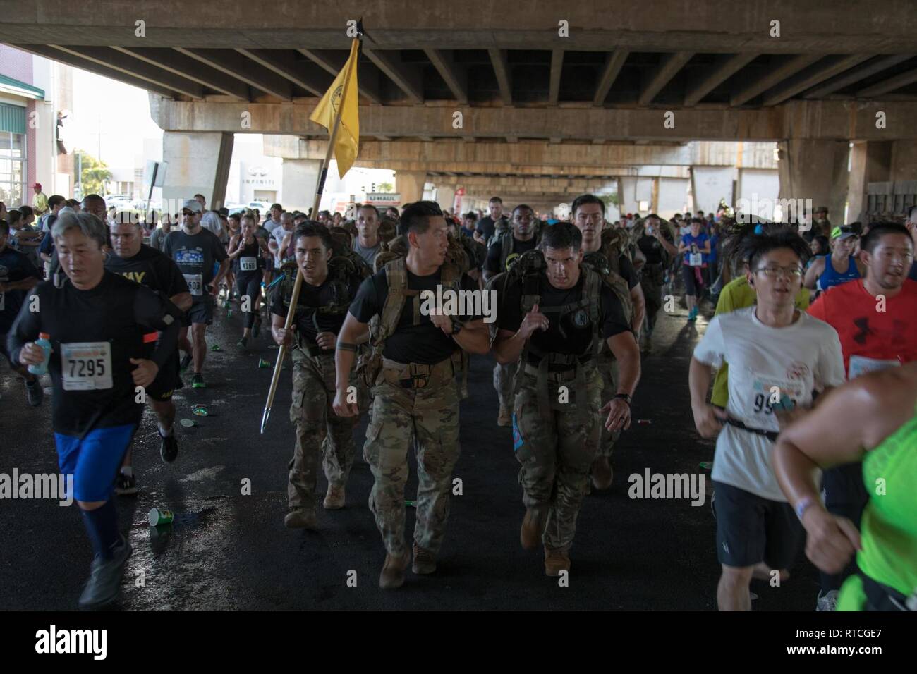 Soldiers of the 25th Infantry Division partner with the community of Hawaii as they participate in the 35th annual Great Aloha Run, Feb. 18, 2019, in downtown Honolulu. The GAR is an 8.35-mile run from the Aloha Tower Lighthouse to the Aloha Stadium that aims to promote a healthier island through Aloha. Stock Photo