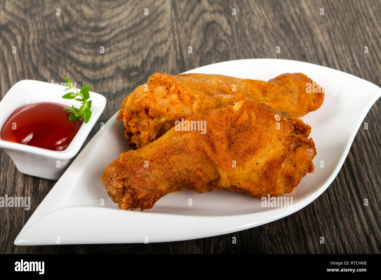 Crispy chicken legs with ketchup Stock Photo Alamy