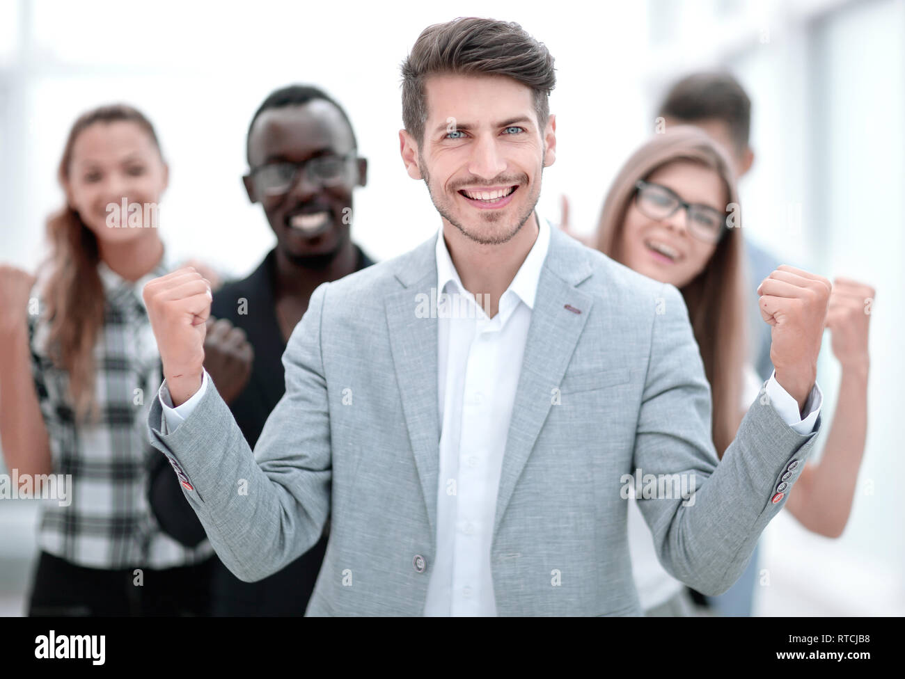 young people standing in the office and smiling Stock Photo - Alamy