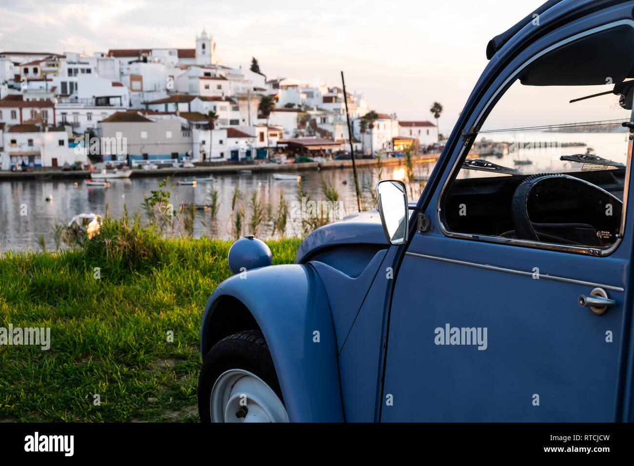 Old 2CV in front of an old city Stock Photo