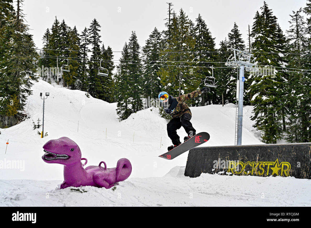 Young boy  snowboarding  at Mount Seymour ski hill, North British Columbia, Canada Stock Photo