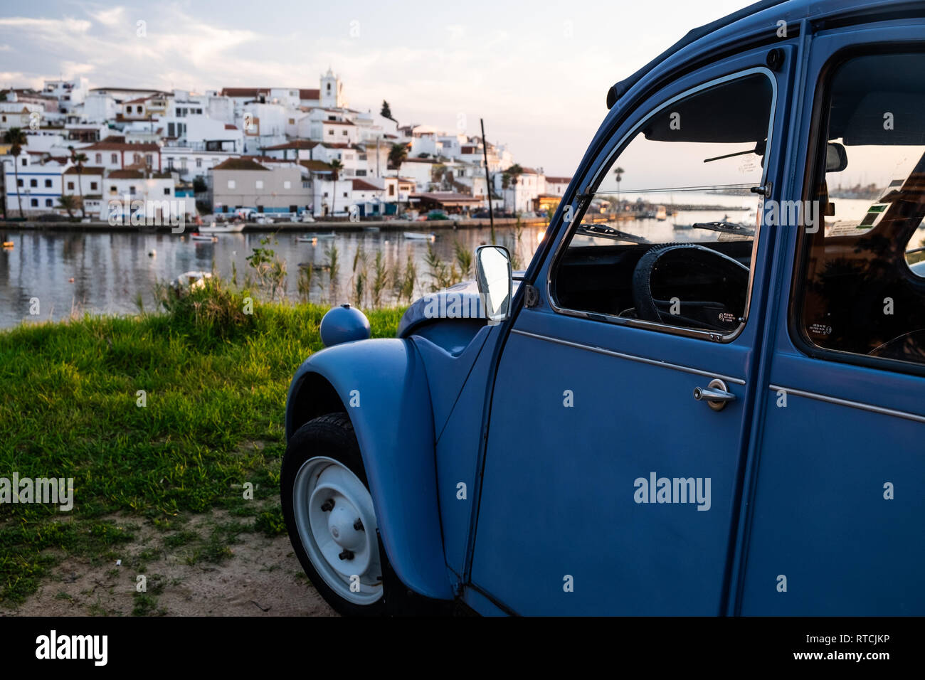 Old 2CV in front of an old city Stock Photo