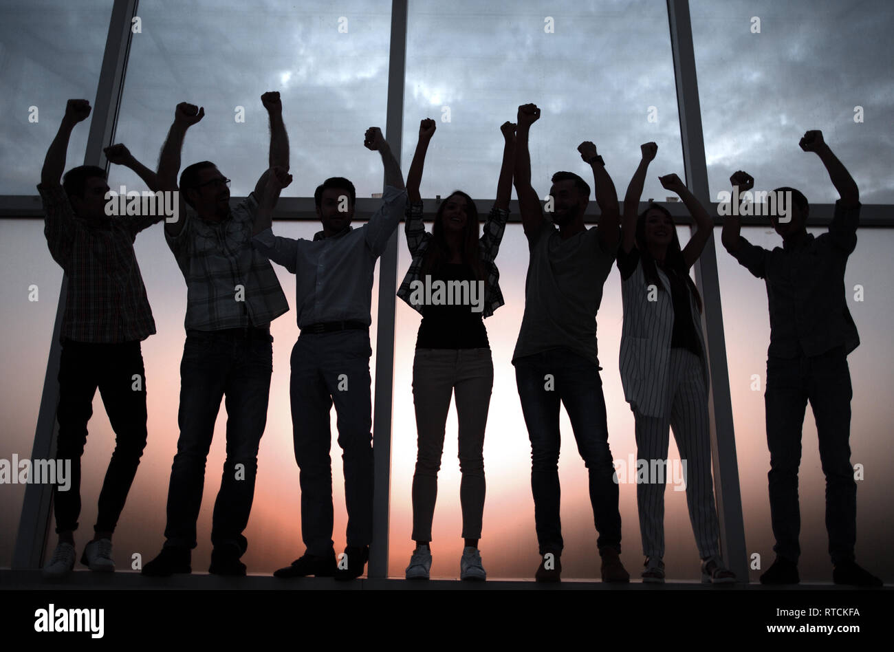 friendly business team standing near the office window Stock Photo - Alamy