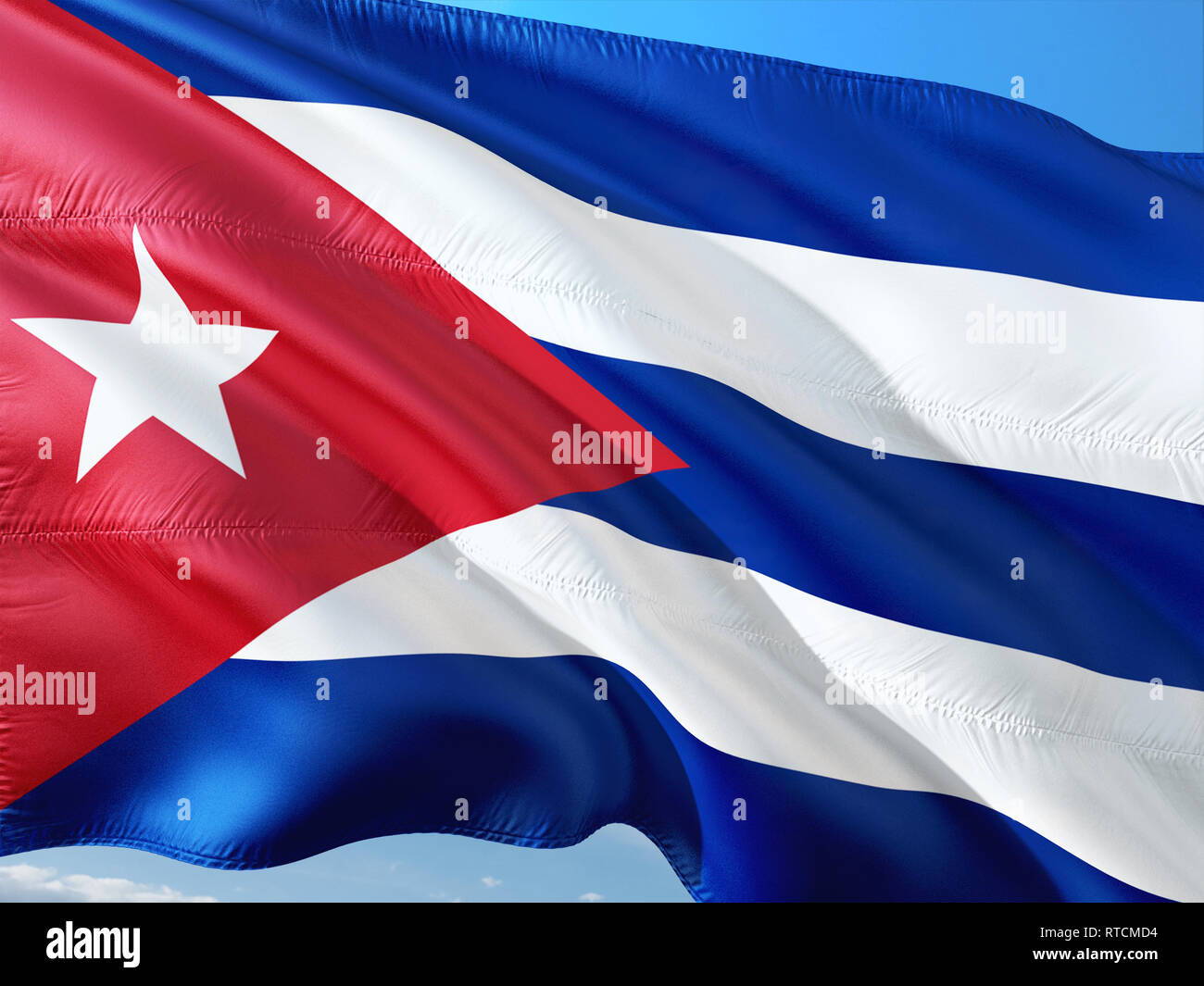 Flag of Cuba waving in the wind against deep blue sky. High quality ...