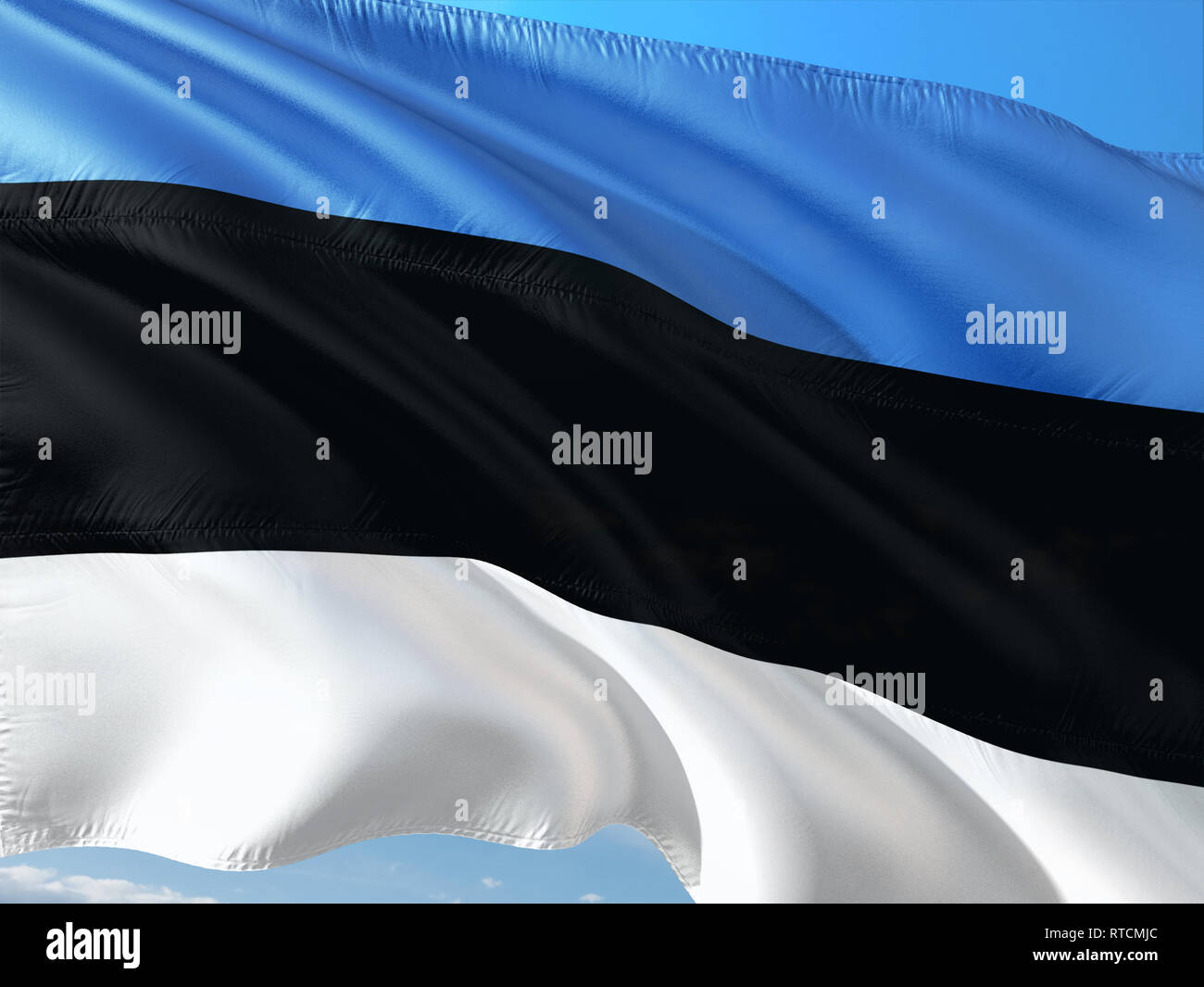 Flag of Estonia waving in the wind against deep blue sky. High quality ...