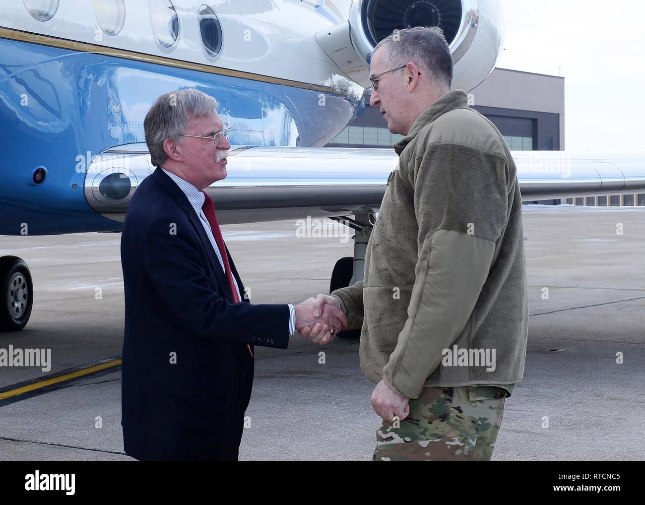Air Force Gen. John Hyten, commander of United States Strategic Command (USSTRATCOM), greets Ambassador John Bolton, National Security Advisor, during his trip to USSTRATCOM, Offutt Air Force Base, Neb., Feb. 14, 2019. The Ambassador observed USSTRATCOM’s combat-ready force, engaged in discussions with senior leaders and thanked warfighters for their service to the nation. Bolton’s visit also highlighted USSTRATCOM’s critical role in the National Security Strategy. Stock Photo