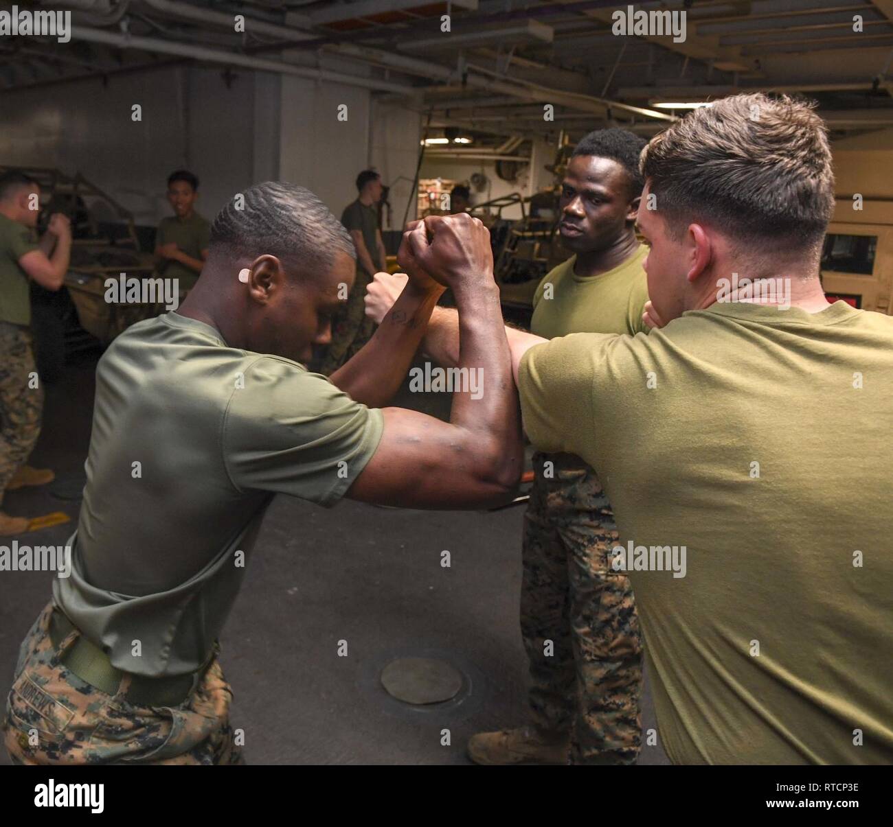 Pacific Ocean Feb 14 19 Corporal Emanual Addomensah A Marine Assigned To The 11th Marine Expeditionary Unit Teaches A Mcmap Marine Corps Martial Arts Program Class In The Lower V Onboard Amphibious Pacific Ocean Feb 14 19 Corporal Emanual Addomensah A Marine Assigned To The 11th Marine Expeditionary Unit Teaches A Mcmap Marine Corps Martial Arts Program Class In The Lower V Onboard Amphibious