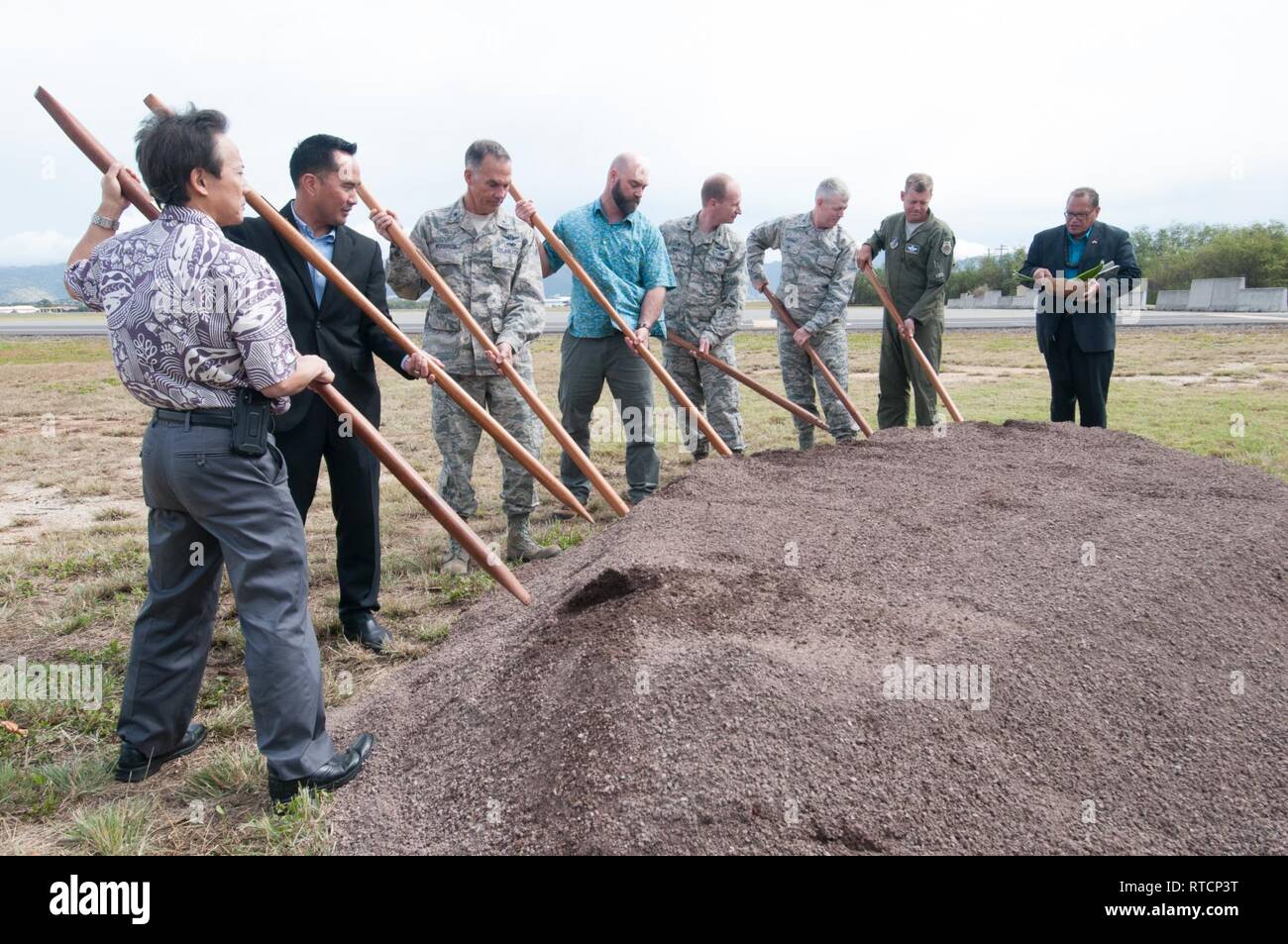 Representatives from Pacific Air Forces, 154th Wing, 15th Wing, Air Force Civil Engineer Center, and the United States Army Corps of Engineers participate in a ground-breaking ceremony for the new F-22 Aerospace Control Alert (ACA) Facility on Feb 14, 2019 at Joint Base Pearl Harbor-Hickam, Hawaii. The blessing was performed by Kahu Kelekona Bishaw and included seven ground-breaking o’o sticks used in traditional Hawaiian ceremonies. Stock Photo