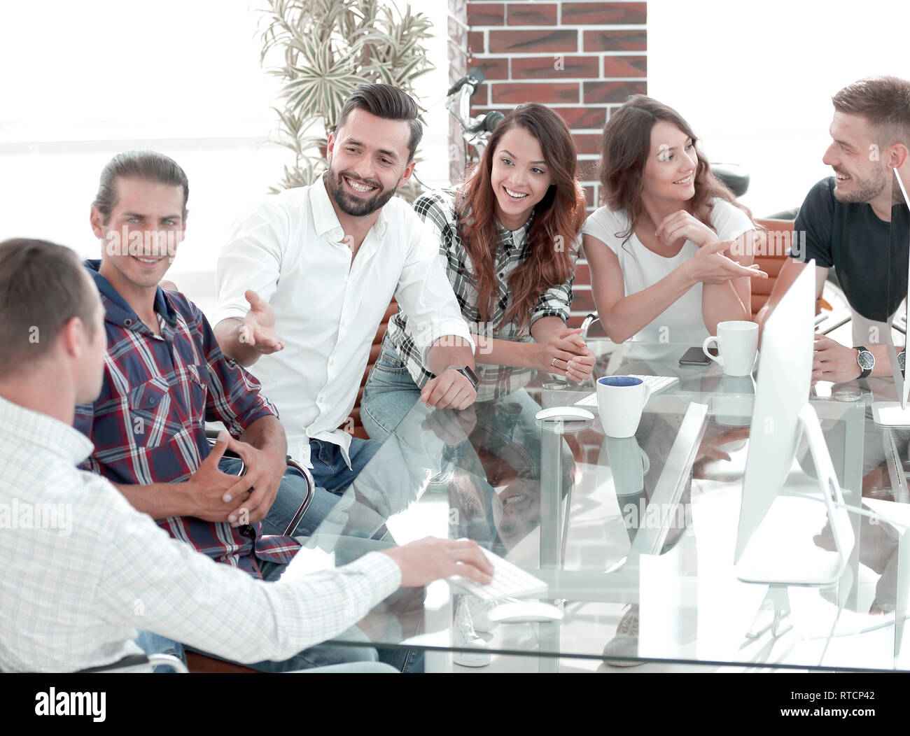 Creative workers design together in the Studio. Stock Photo