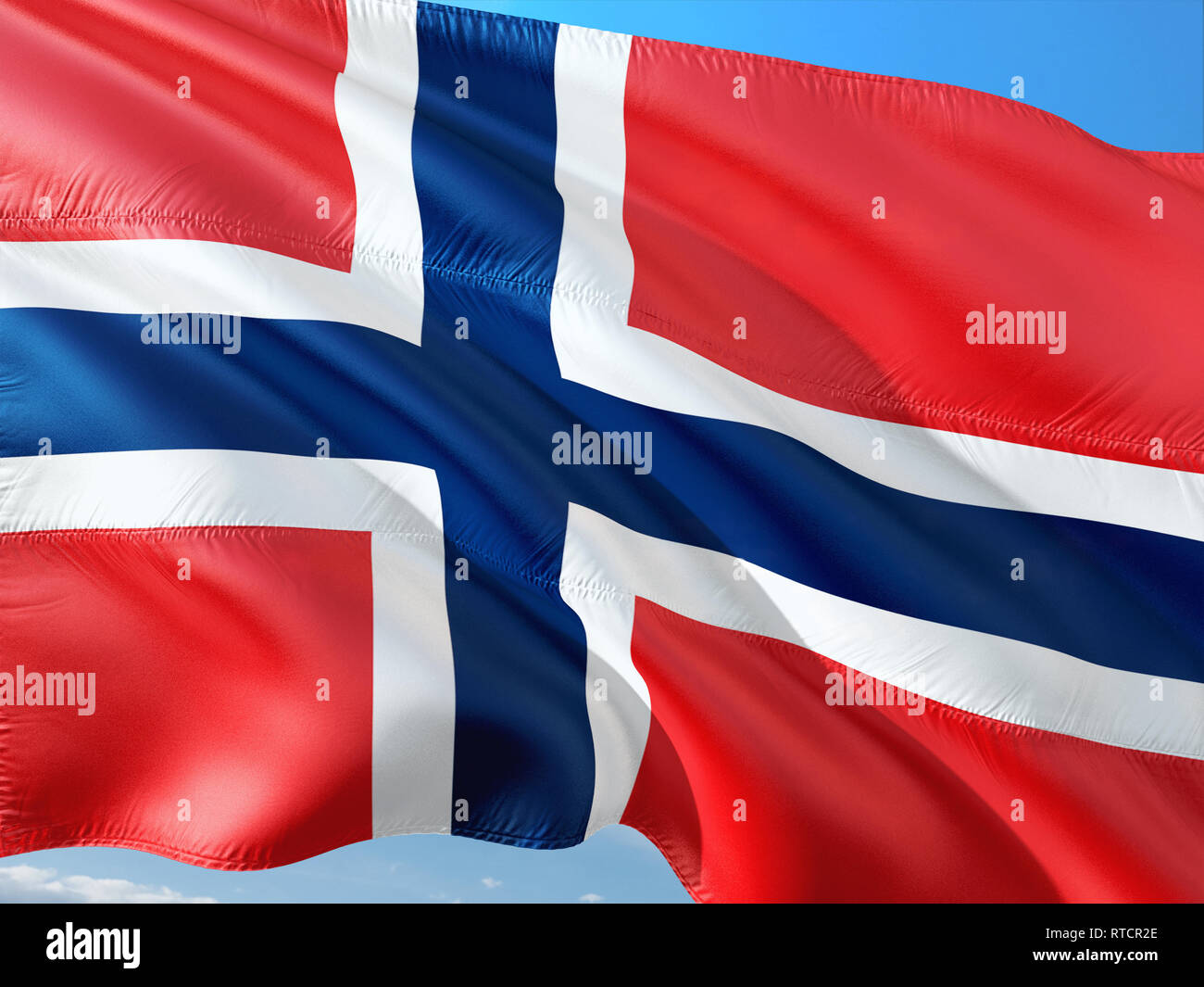 Flag of Norway waving in the wind against deep blue sky. High quality ...