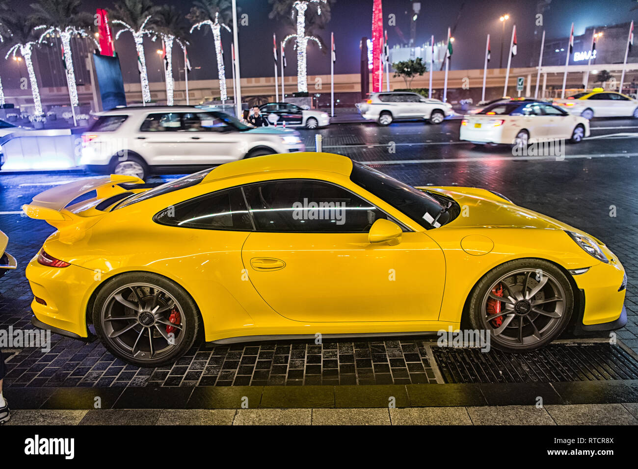 DUBAI, UAE - december 23, 2017: luxury Supercar Porsche 911 Carrera 4 GTS  yellow color parked next to Dubai mall. Lamborghini is famous expensive  automobile brand car Stock Photo - Alamy