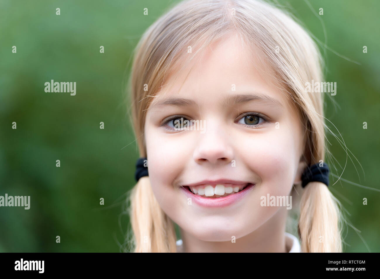 Child With Smile On Cute Face On Natural Background Little Girl