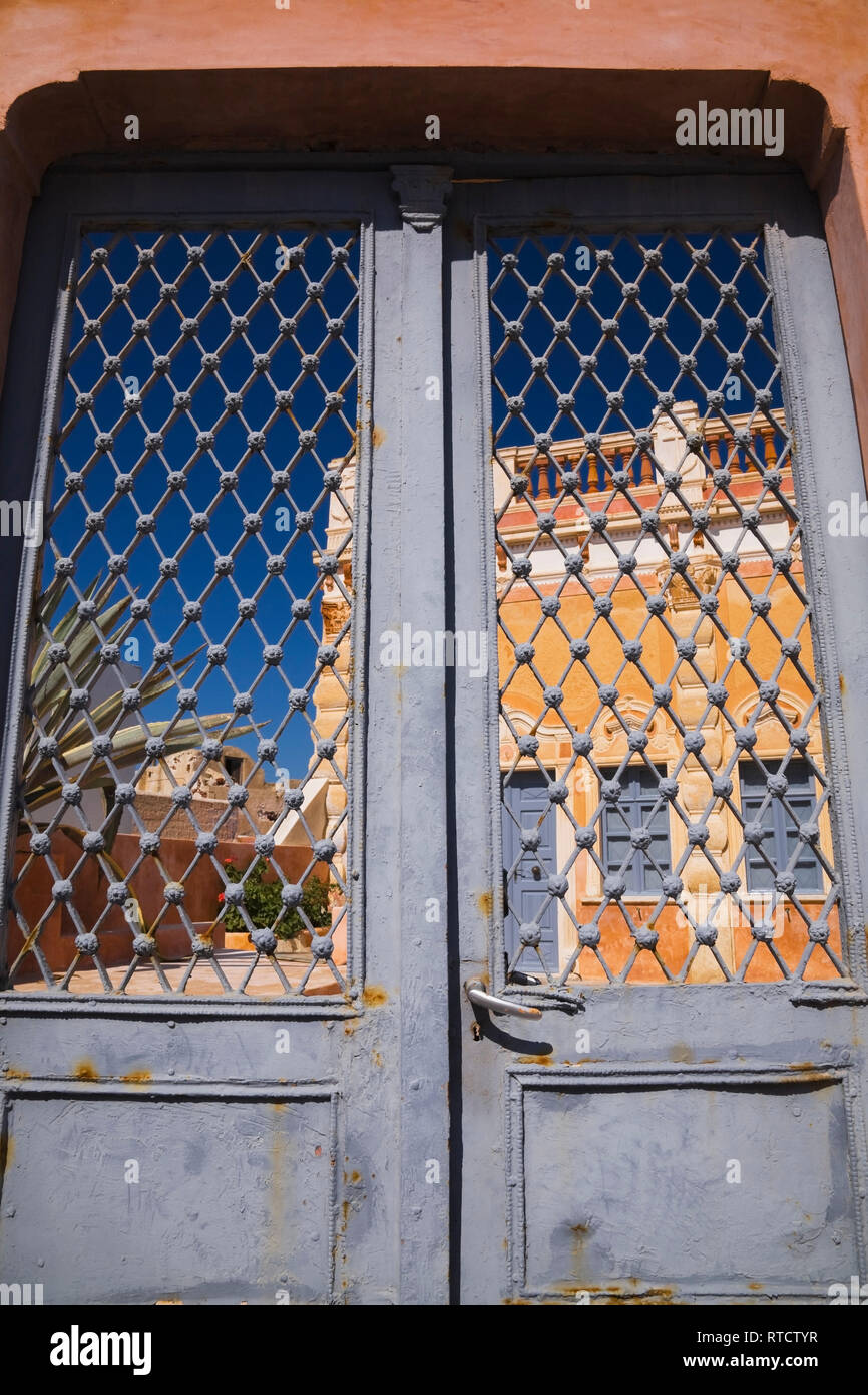 Old gray painted iron gate doors, Oia, Santorini, Greece Stock Photo
