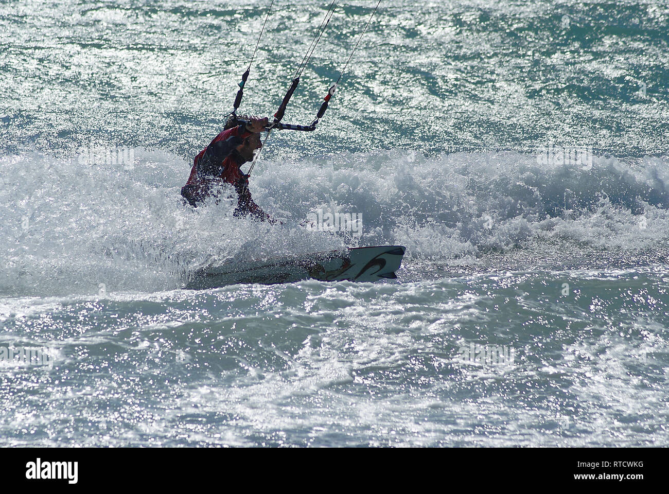 Kite boarder in the white foam during a windy day in french riviera Stock Photo