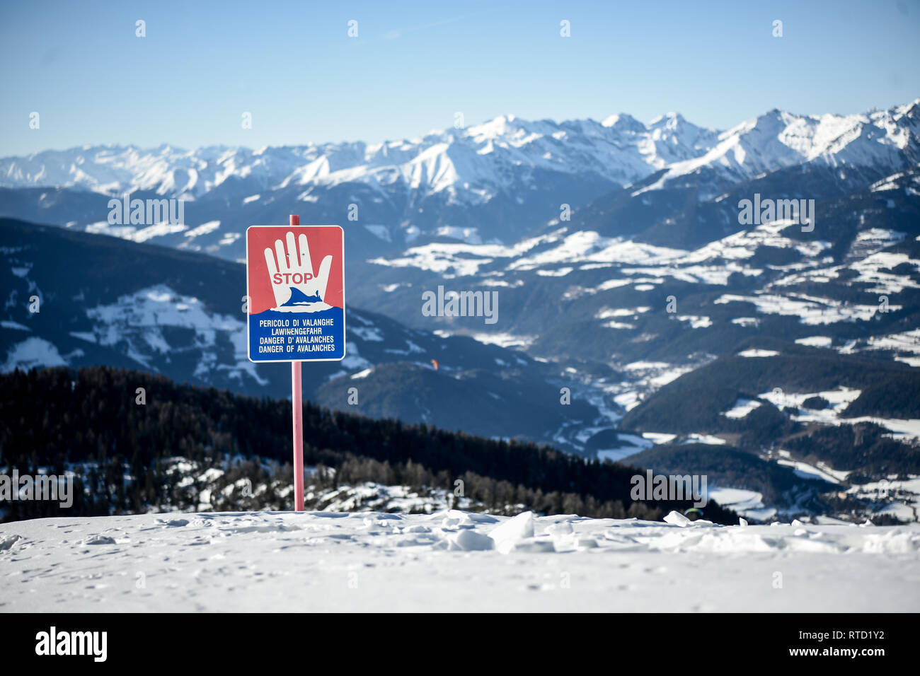 Kronplatz, South Tyrol, Italy - February 15, 2019: Danger of Avalanches warning  sign on snowy mountain slope in Kronplatz Plan de Corones ski resort  Stock Photo