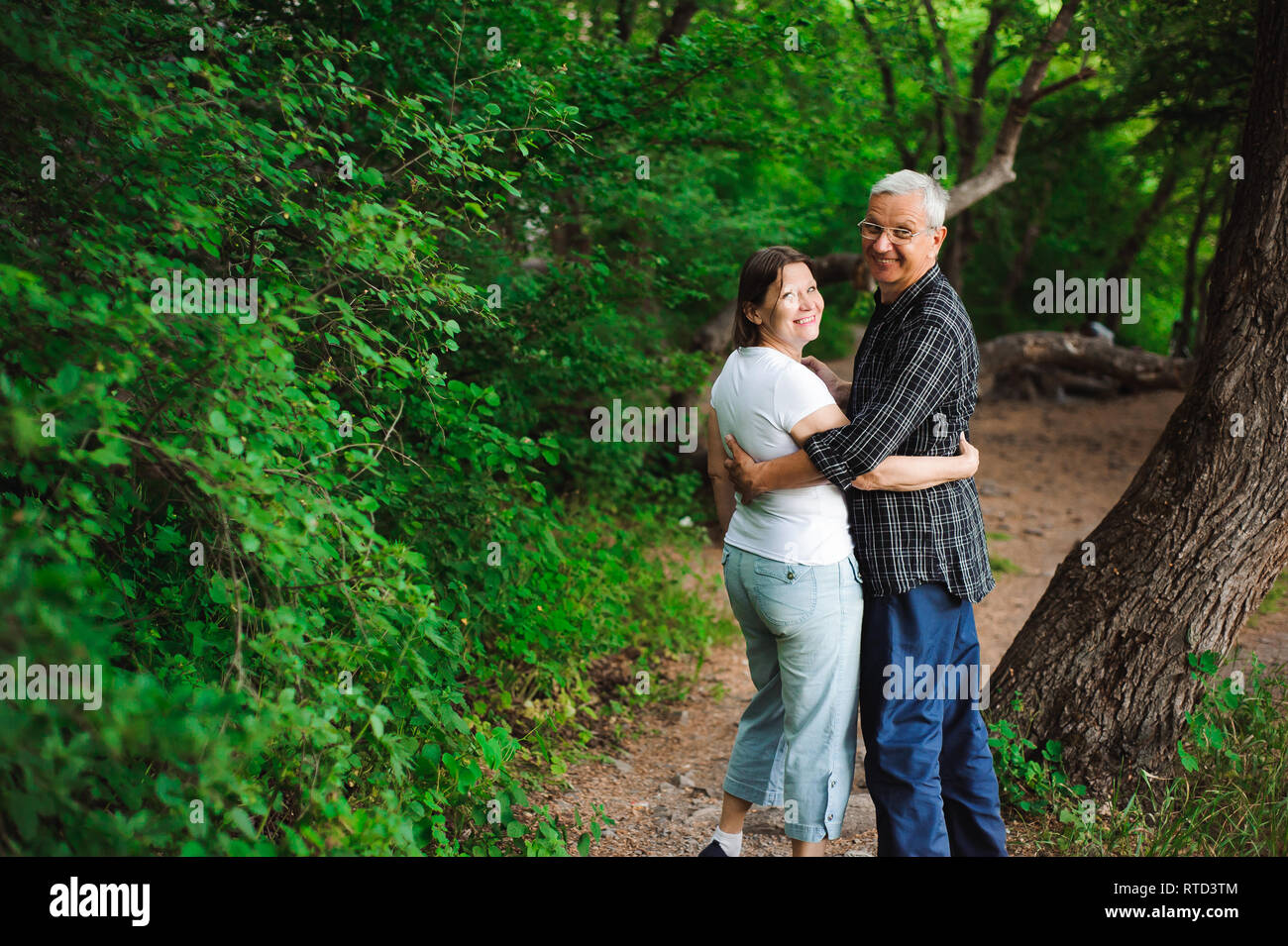 Older man walking dog in forest hi-res stock photography and images - Alamy