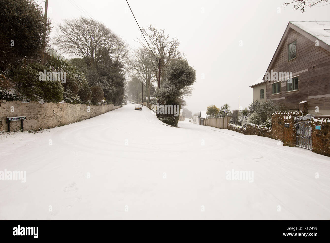 A snowy scene at Sandhills Road in Salcombe after the beast from the east struck south Devon. Salcombe was then hit by Storm Emma. Stock Photo