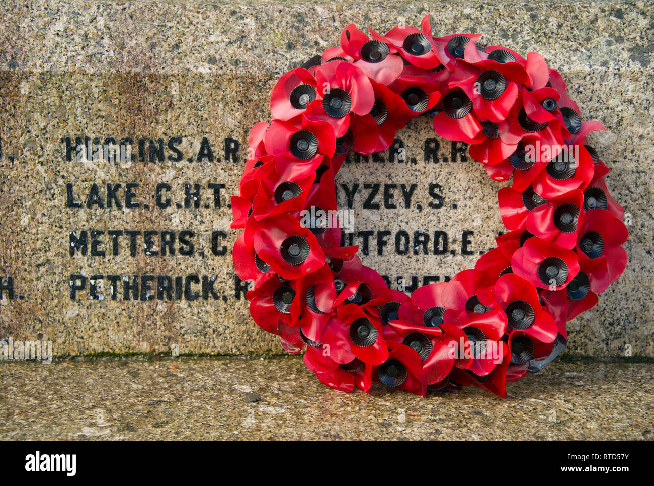 Rememberence poppy wreath on a war memorial in Lydford, Devonshire, UK Stock Photo