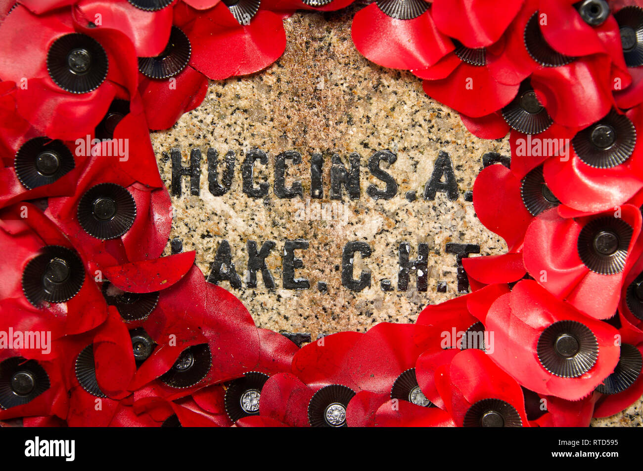 Rememberence poppy wreath on a war memorial in Lydford, Devonshire, UK Stock Photo