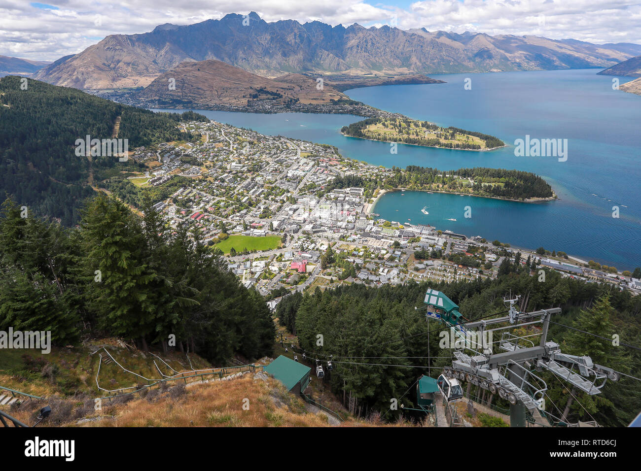 Queenstown and Lake Wakatipu from the restaurant on Ben Lomond mountain Skyline gondola.The Remarkables in background. New Zealand South Island Stock Photo