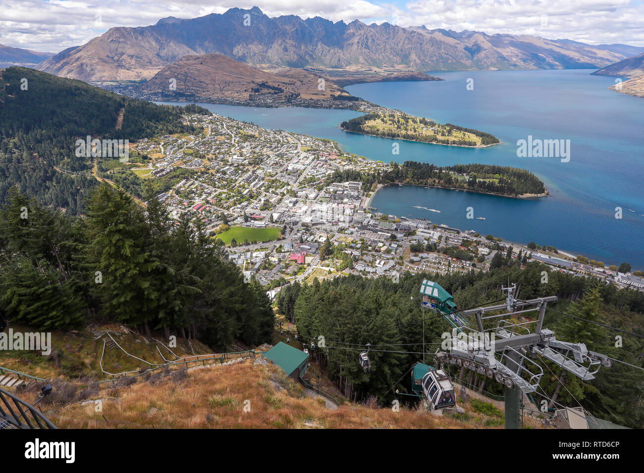 Queenstown and Lake Wakatipu from the restaurant on Ben Lomond mountain Skyline gondola.The Remarkables in background. New Zealand South Island Stock Photo