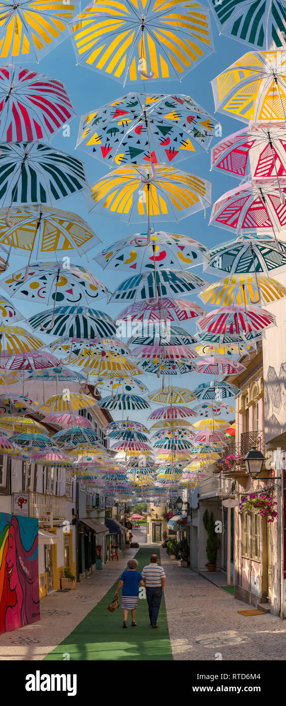 Umbrella Sky Project, street covered with bold coloured umberllas, Águeda,  Portugal Stock Photo - Alamy