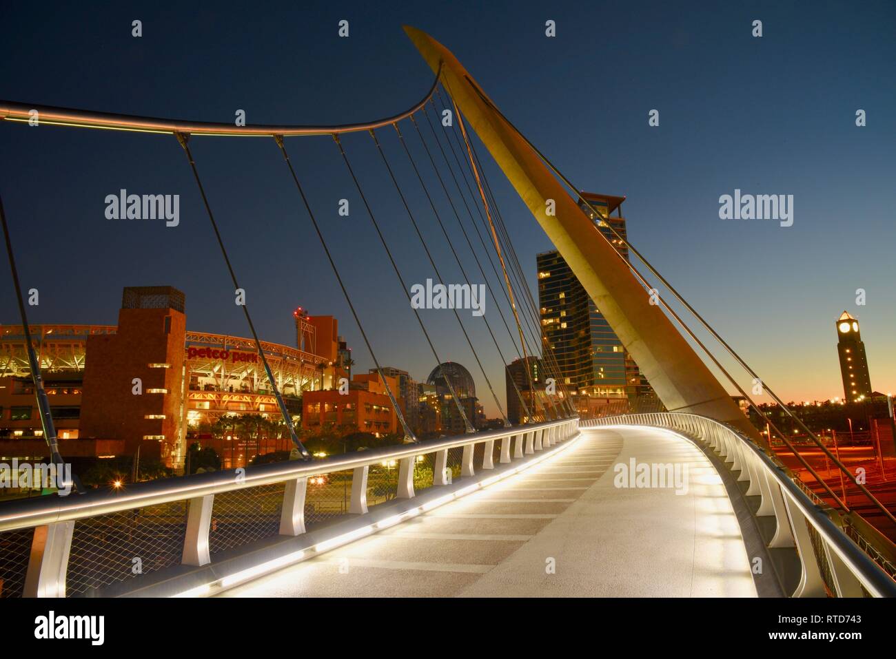 The iconic, modern 500-feet long Harbor Drive Pedestrian Bridge at sunrise, connects Petco Park to San Diego Bay and Convention Center, San Diego, USA Stock Photo