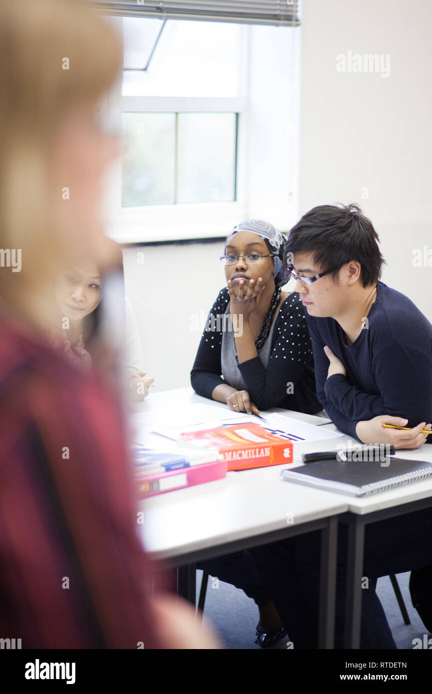 adults in a further education college studying EFL, English as a Foreign Language Stock Photo