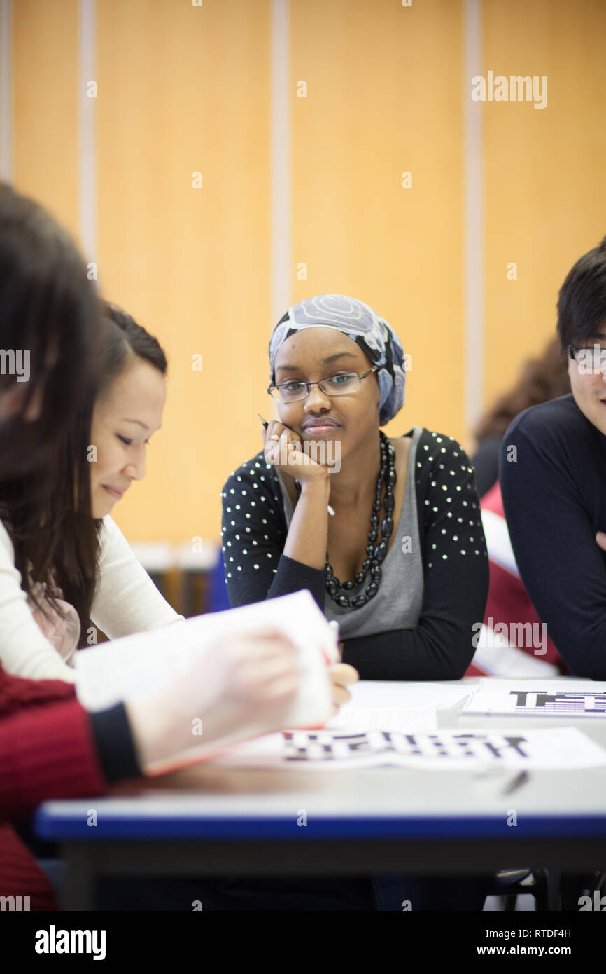 adults in a further education college studying EFL, English as a Foreign Language Stock Photo