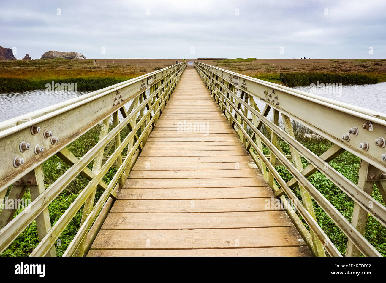 Wood and metal bridge crossing the Rodeo Lagoon towards Rodeo Beach, Headlands, Golden Gate