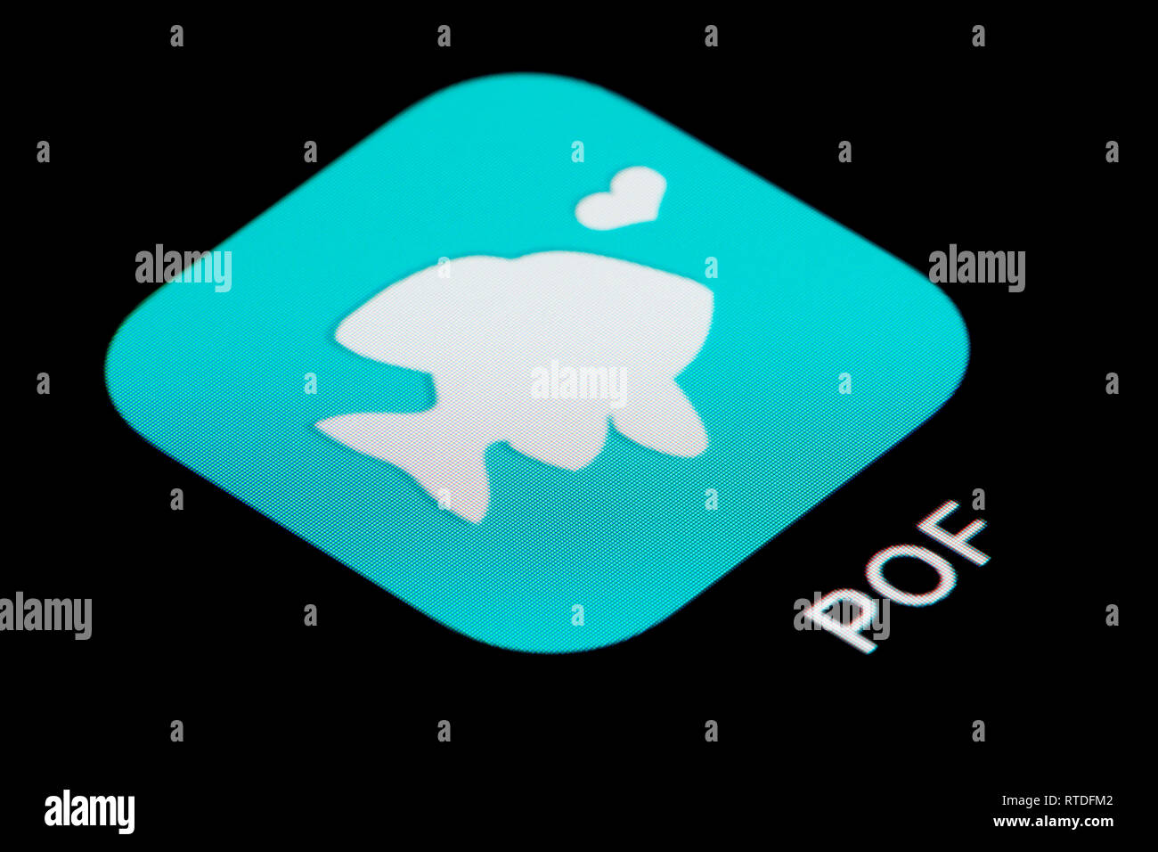 A close-up shot of the Plenty of fish (POF) app icon, as seen on the screen of a smart phone (Editorial use only) Stock Photo