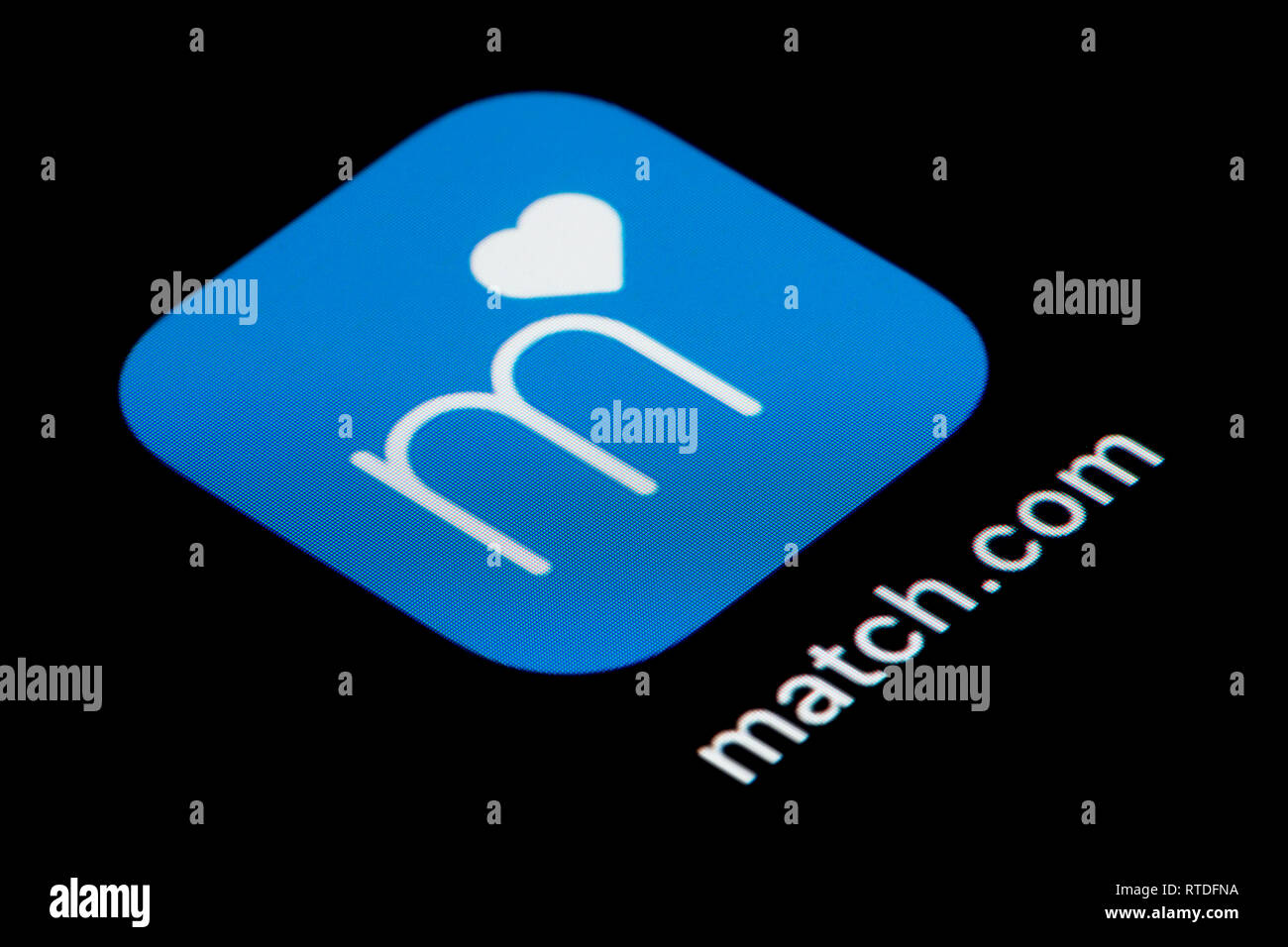 A close-up shot of the Match.com app icon, as seen on the screen of a smart phone (Editorial use only) Stock Photo