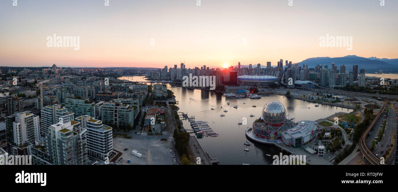 Aerial Panoramic view of a modern city during a sunny summer sunset ...