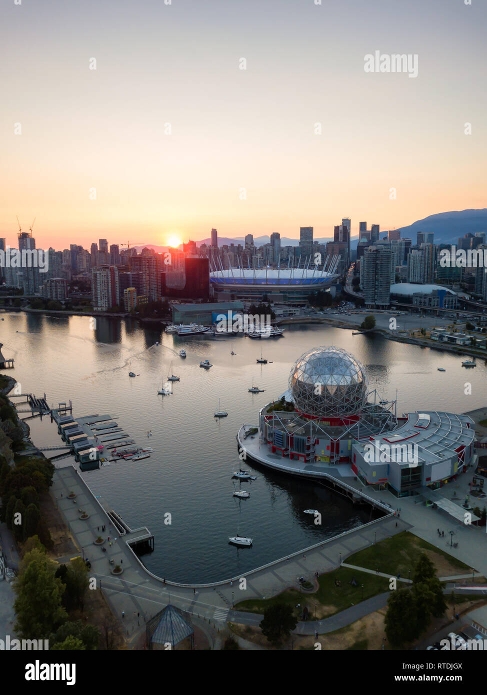 Aerial view of a modern city during a sunny summer sunset. Taken in ...