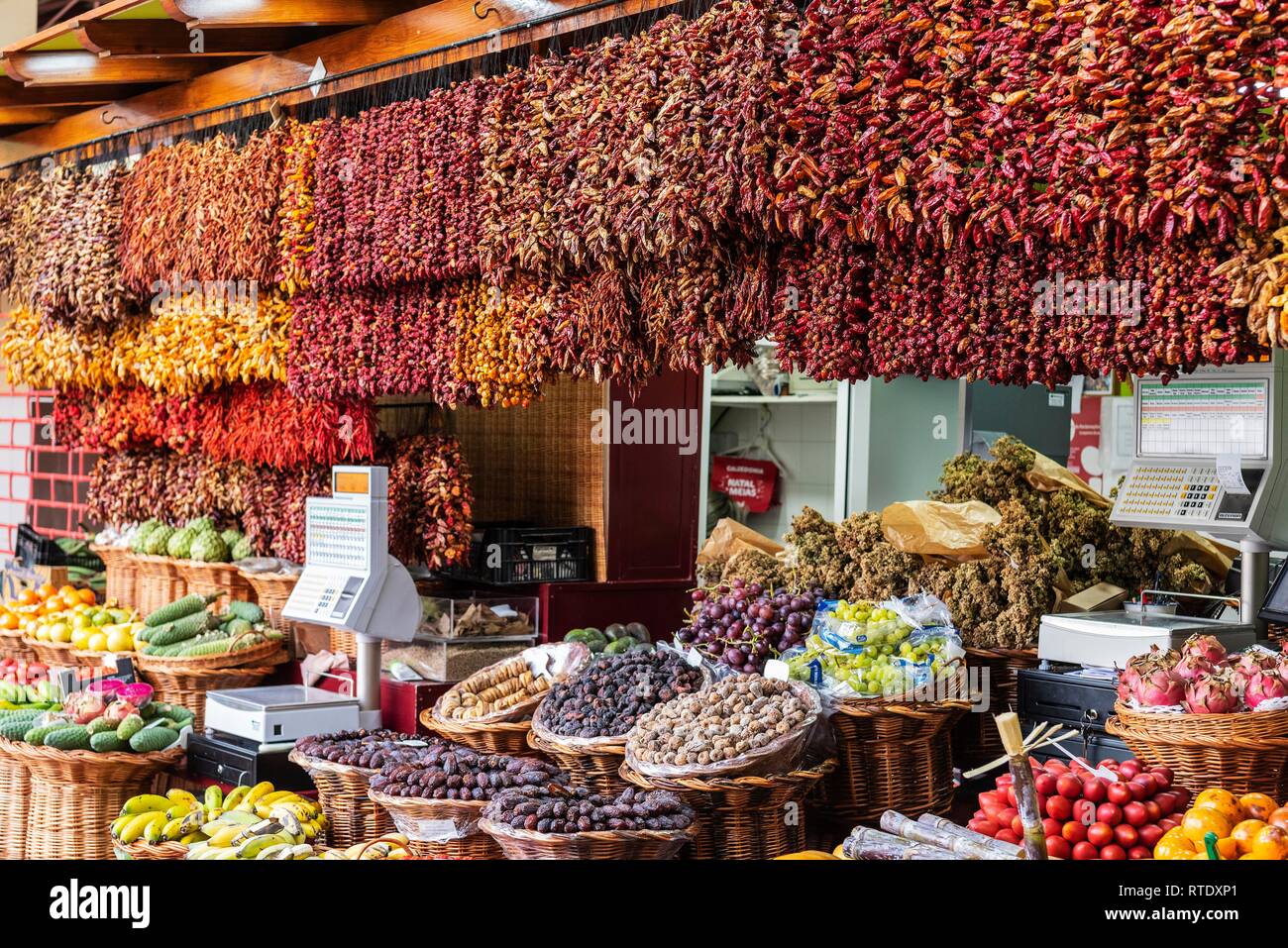 Stall with fruits and dried chilli peppers, chillies, market hall, Funchal, Madeira, Portugal Stock Photo