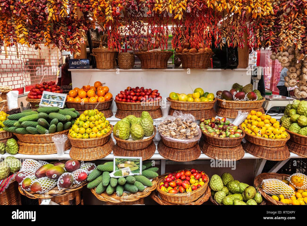 Market stall with various exotic fruits and dried chillies, chillies, market hall, Funchal, Madeira, Portugal Stock Photo