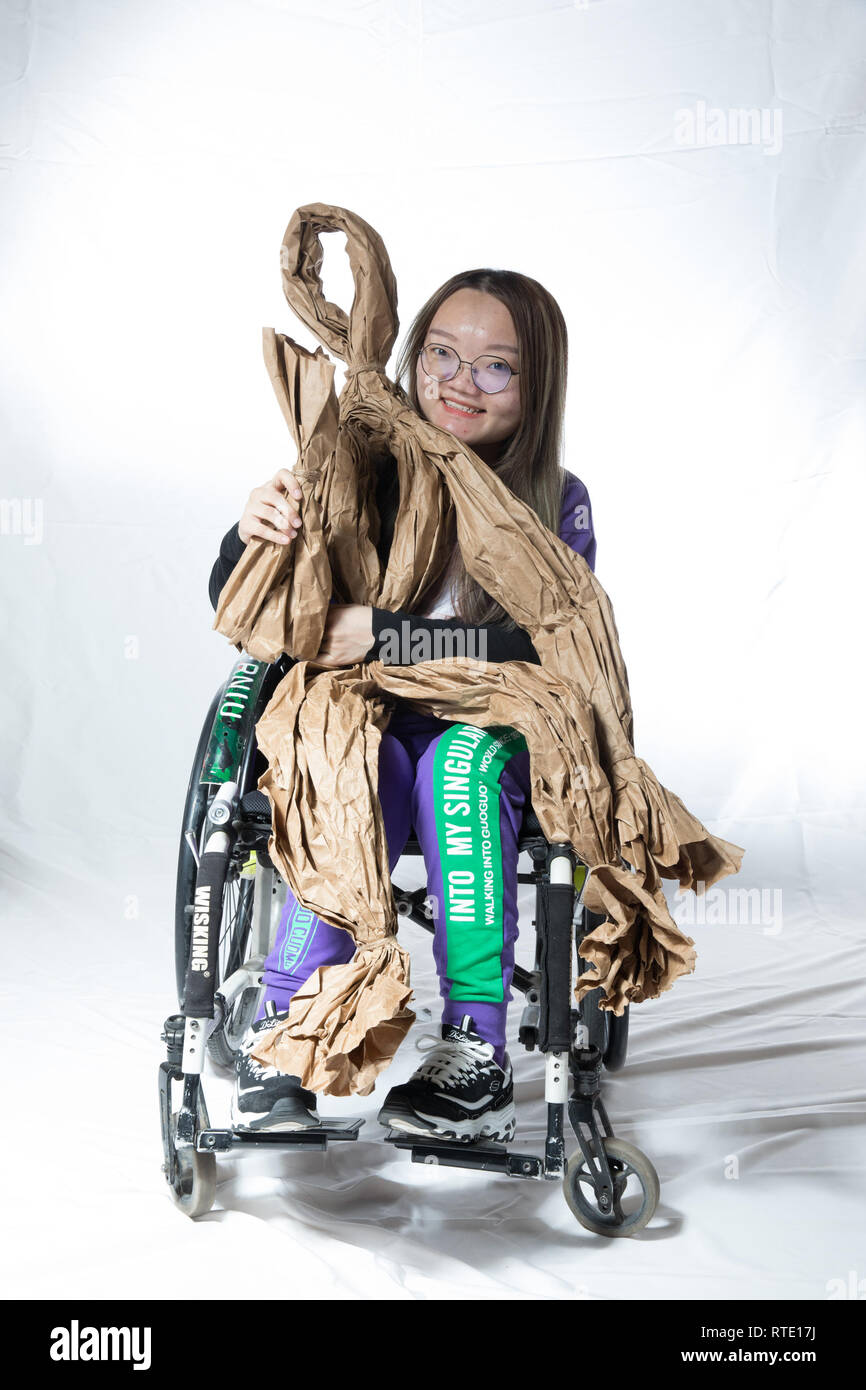 (190301) -- BEIJING, March 1, 2019 (Xinhua) -- Ding Yuan, 22, diagnosed with fibrous dysplasia of bone, poses for a portrait in Beijing, capital of China, Feb. 26, 2019. Getting to know other rare disease patients gave Ding Yuan some thoughts on her perspective on how to accept the way she lives and how to live her life to the fullest. 'Rare Hug,' a Chinese drama on rare diseases, was staged at the Beijing Tianqiao Performing Arts Center Wednesday evening to mark the 12th Rare Disease Day, which falls on Feb. 28, 2019 under the theme 'Bridging Health and Social Care.' The drama was played Stock Photo