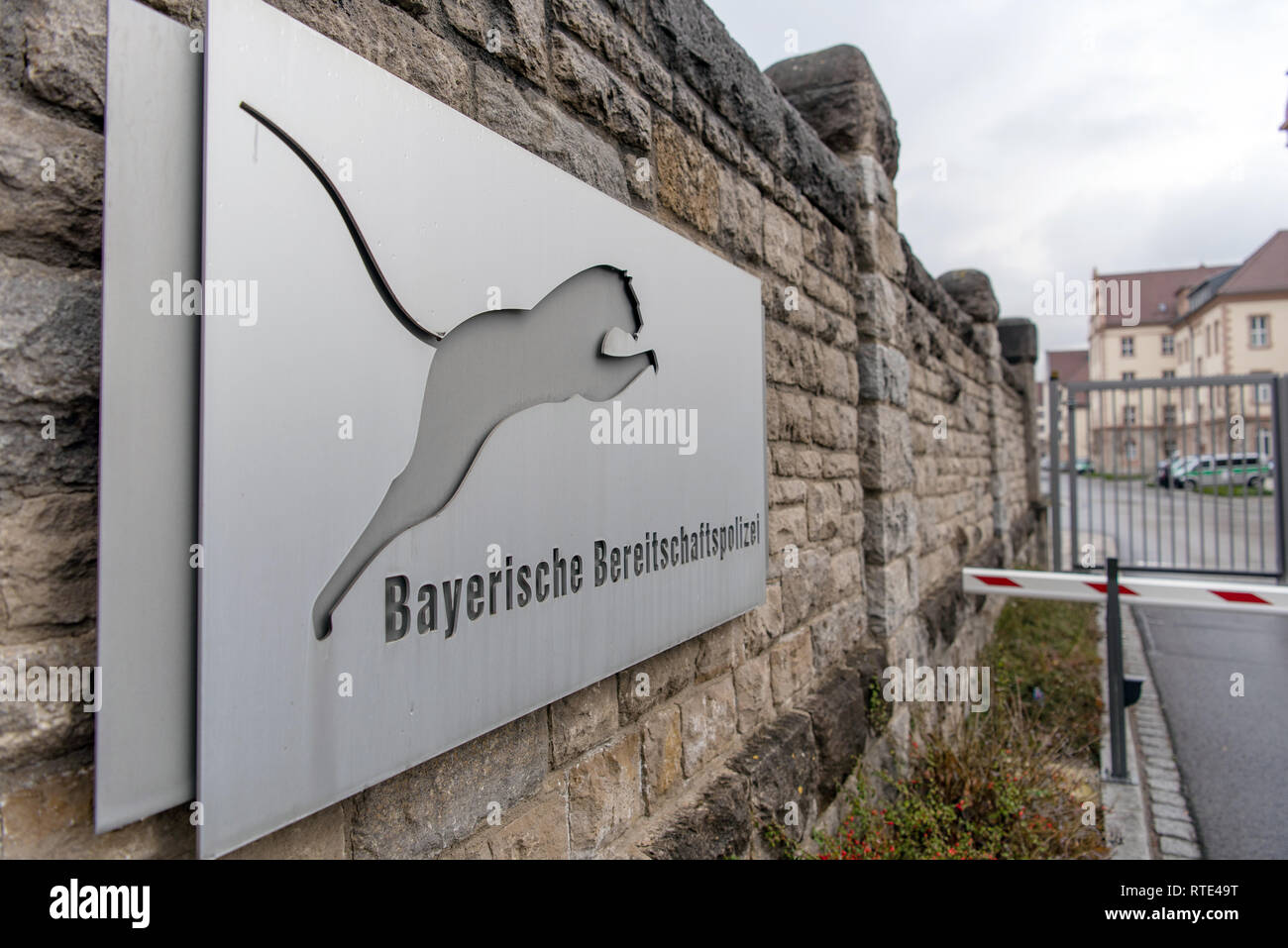 01 March 2019, Bavaria, Würzburg: A sign with the inscription 'Bayerische Bereitschaftspolizei' (Bavarian Riot Police) is placed in front of the entrance to the Mainau barracks, the seat of the riot police III. department Würzburg. A police trainee apparently accidentally shot a fellow trainee in Würzburg. The young police candidate was shot and died shortly afterwards in hospital of his injuries, as police and public prosecutor's office jointly reported on early Friday morning. Photo: Nicolas Armer/dpa Stock Photo