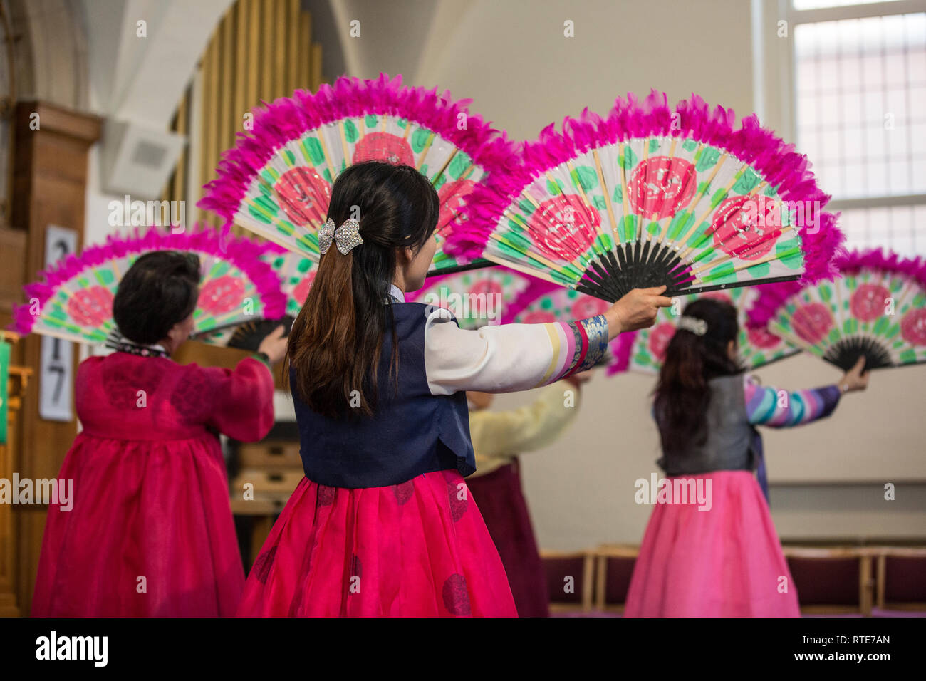 London, UK. 1st March 2019. North and South Korean Ladies perform the Buchaechum also called a Fan Dance on the day Korea Commemorates 100th Anniversary of March 1st Independence Movement. New Malden Methodist Church, London, England, UK Credit: Jeff Gilbert/Alamy Live News Stock Photo