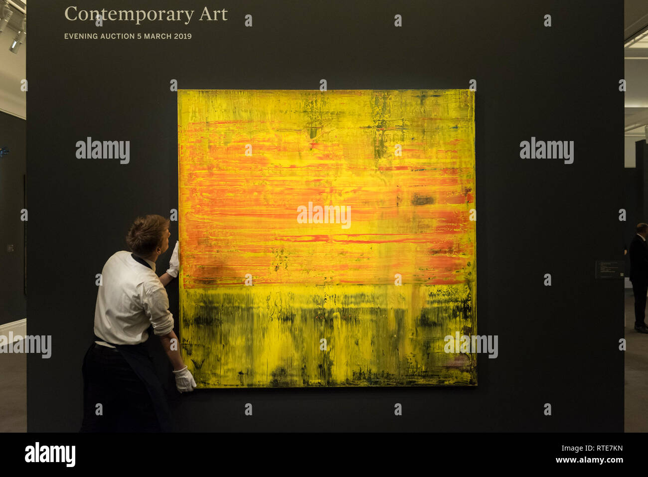 London, UK.  1 March 2019. A technician examines ''Abstraktes Bild'', 2009, by Gerhard Richter, (Est. £6,000,000 - 8,000,000).  Preview of Sotheby's Contemporary Art Sale in their New Bond Street galleries.  Works by artists including Tracey Emin, Jenny Saville, Jean-Michel Basquiat and Andy Warhol will be offered for auction on 5 March 2019.   Credit: Stephen Chung / Alamy Live News Stock Photo