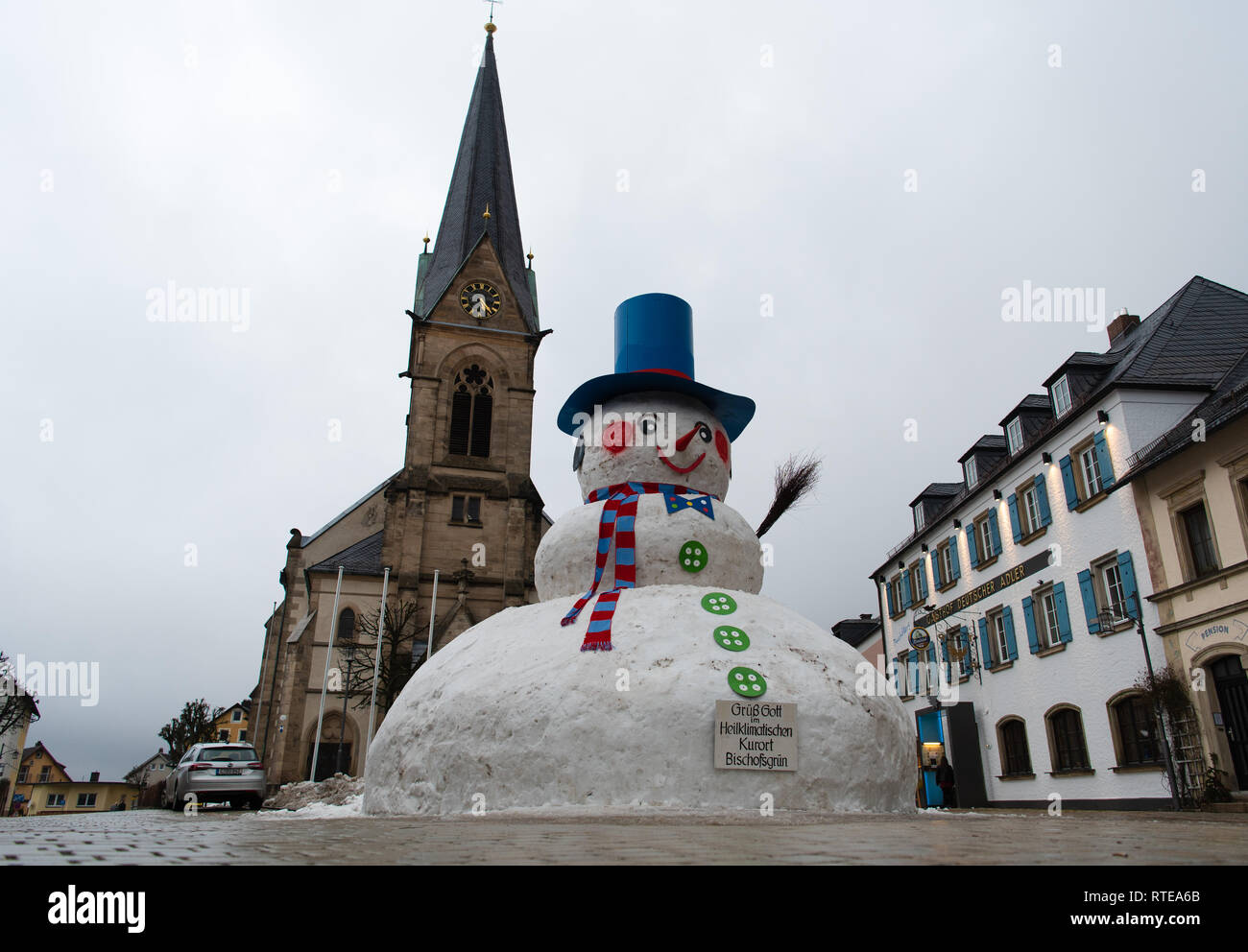 Bischofsgrün, Bavaria, Germany. 01st March, 2019. The giant snowman from Bischofsgrün has reached a height of about 10 metres this year. With a cylinder, pink cheeks and a pointed nose, the monster named Jakob is now enthroned in the middle of town. Ten volunteers have erected the snowman on Friday according to proven tradition. Photo: Nicolas Armer/dpa Credit: dpa picture alliance/Alamy Live News Stock Photo
