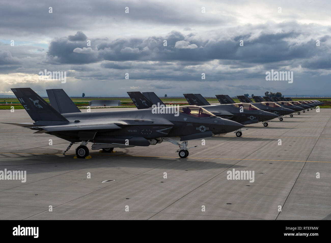 190227-N-WR119-0043 NAVAL AIR STATION LEMOORE, Calif. (Feb. 27, 2019) Ten F-35C Lightning II jets of the 'Argonauts' of VFA-147 aircraft sit on the flight line at Naval Air Station Lemoore (NASL).  Commander, Naval Air Forces, Vice Admiral DeWolfe Miller H. III and United States Marine Corps Deputy Commandant for Aviation (DCA), Lieutenant General Steven R. Rudder jointly announced that the F-35C met all requirements and achieved Initial Operating Capability (IOC) 28FEB.  Achieving IOC means the F-35C is available to be used in deployed environments as requested by combatant commanders. (U.S.  Stock Photo
