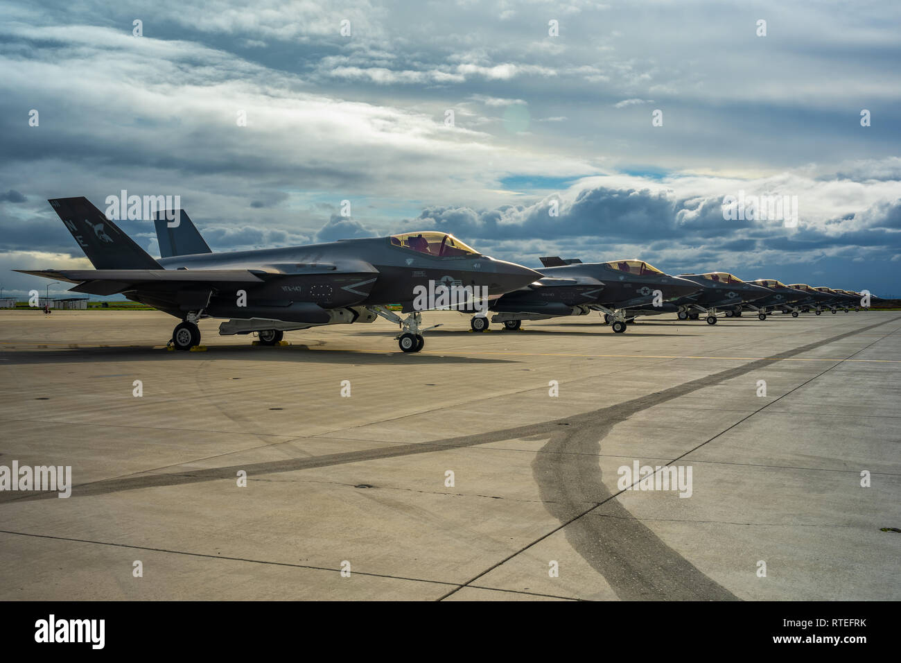 190227-N-KT595-003 LEMOORE, Calif. (Feb. 27, 2019) Ten VFA-147 Argonaut F-35C aircraft are displayed on the flightline here at Naval Air Station Lemoore (NASL) in celebration of the F-35C's Initial OperationalCapability (IOC) announcement today. IOC declaration is a capability-driven joint decision made by Commander, Naval Air Forces, Vice Admiral DeWolfe Miller III and United Sates Marine Corps Deputy  Commandant for Aviation (DCA), Lieutenant General Stephen R. Rudder.  Achieving IOC means the F-35C is available to be used in deployed environments as requested by combatant commanders. (U.S.  Stock Photo