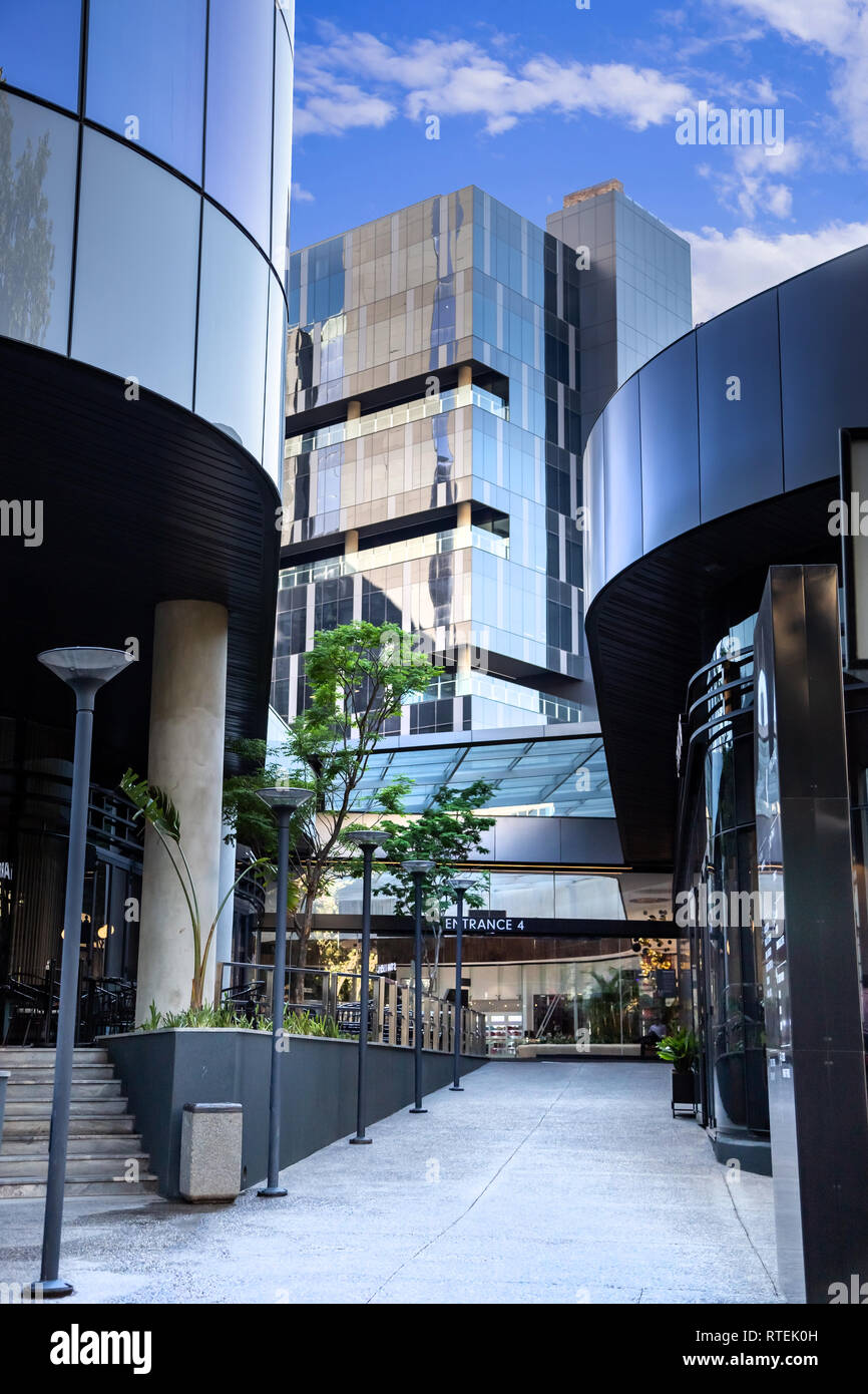 Johannesburg, South Africa, 28 November - 2018: Entrance to modern hotel and mall with glass facades. Stock Photo