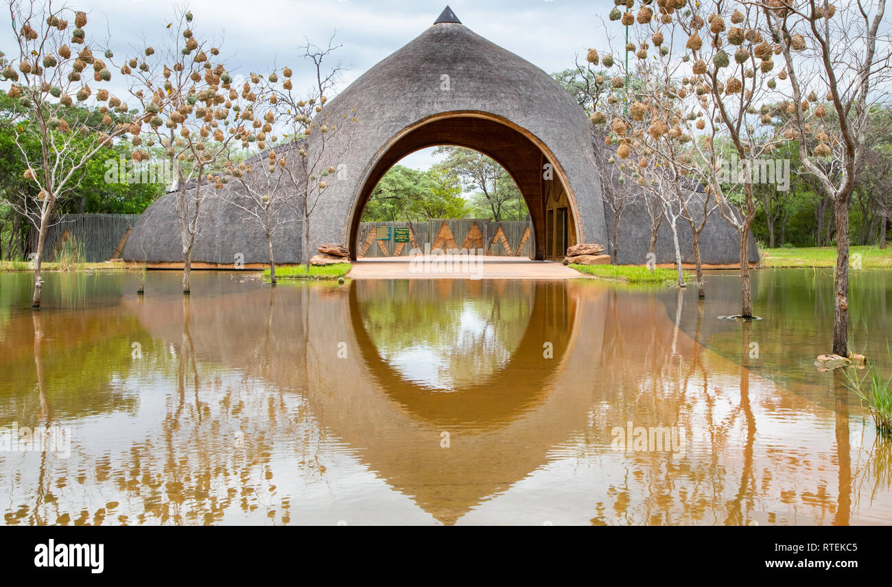 Nata, Botswana, 7 January -2019: Entrance to game farm with driveway flooded with water Stock Photo